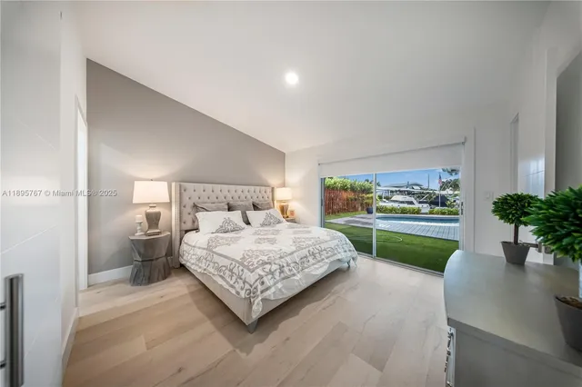 a bedroom with a bed and a view of bedroom