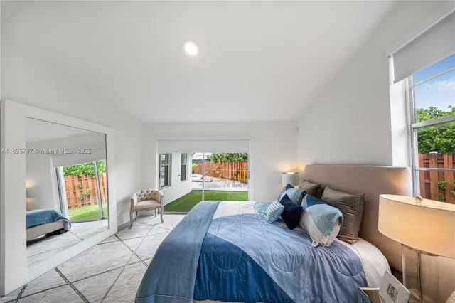 a bedroom with a bed and a couch