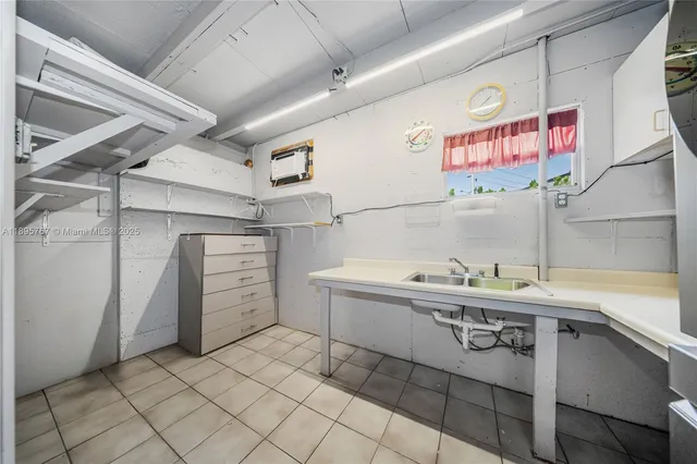 a kitchen with a sink and cabinets