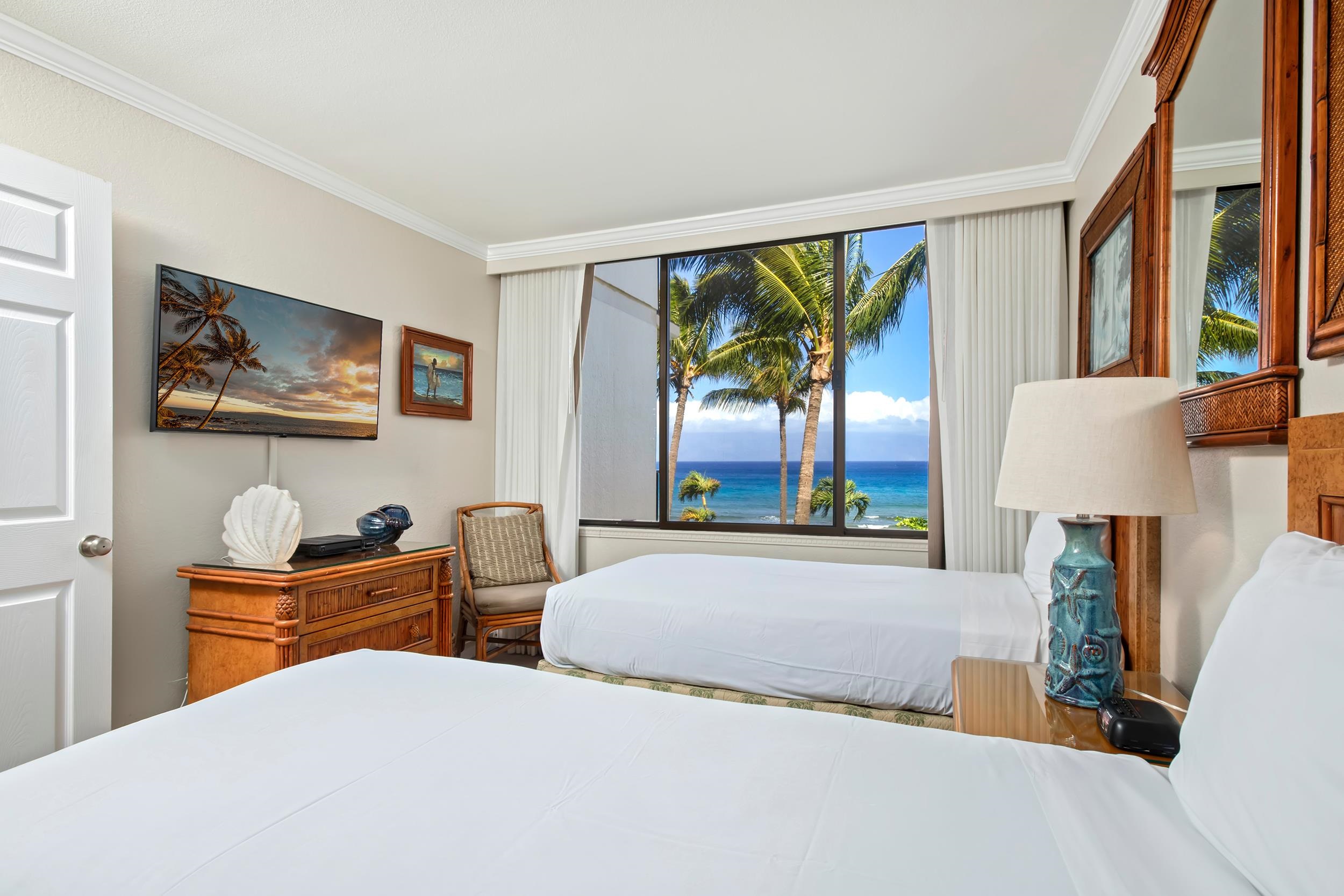 3445 Lower Honoapiilani Road, Unit 304 Lahaina, HI 96761 - Photo 14 of 41 a bedroom with a large bed and a window