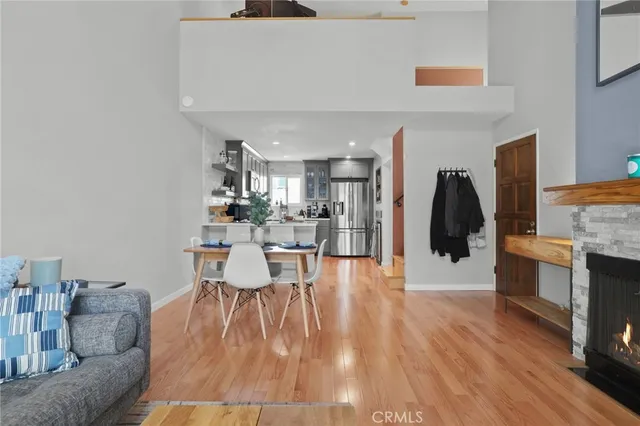 a dining room with furniture and wooden floor