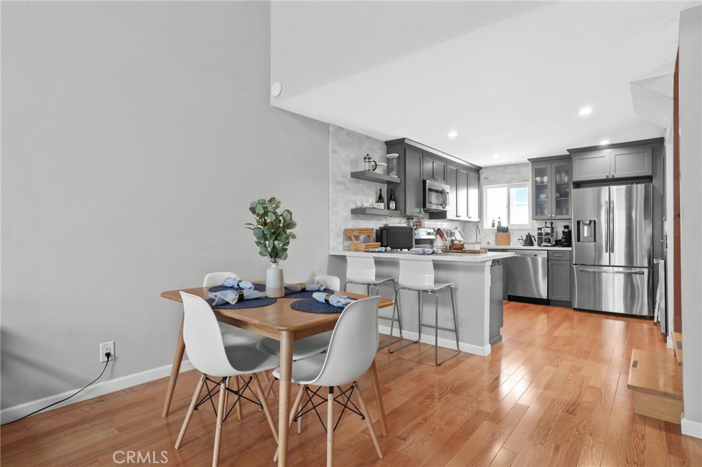 11954 Goshen Avenue, Unit 205 Los Angeles, CA 90049 - Photo 16 of 48 a kitchen with a table and chairs in it