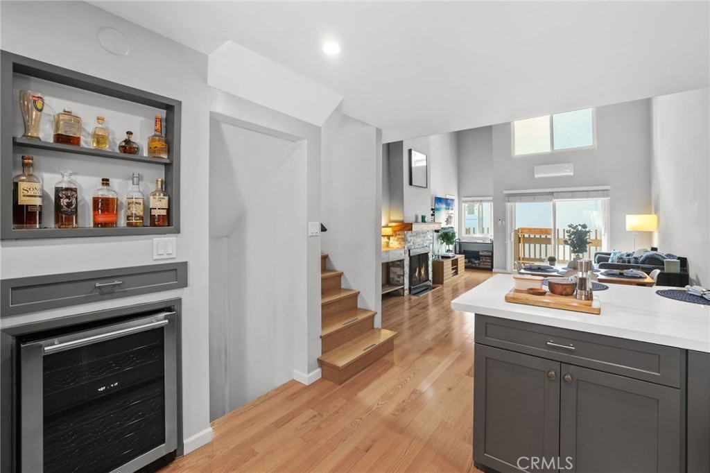 11954 Goshen Avenue, Unit 205 Los Angeles, CA 90049 - Photo 23 of 48 a kitchen with a stove a refrigerator and a sink with wooden floor