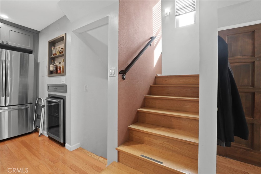 11954 Goshen Avenue, Unit 205 Los Angeles, CA 90049 - Photo 24 of 48 a view of entryway with wooden floor and a livingroom view