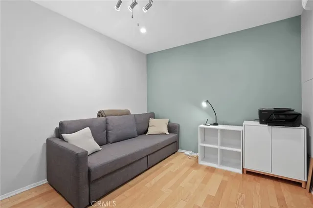 a bathroom with a toilet a sink a shower and mirror