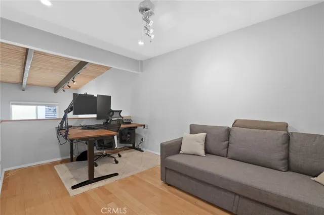 a room with furniture and a wooden floor