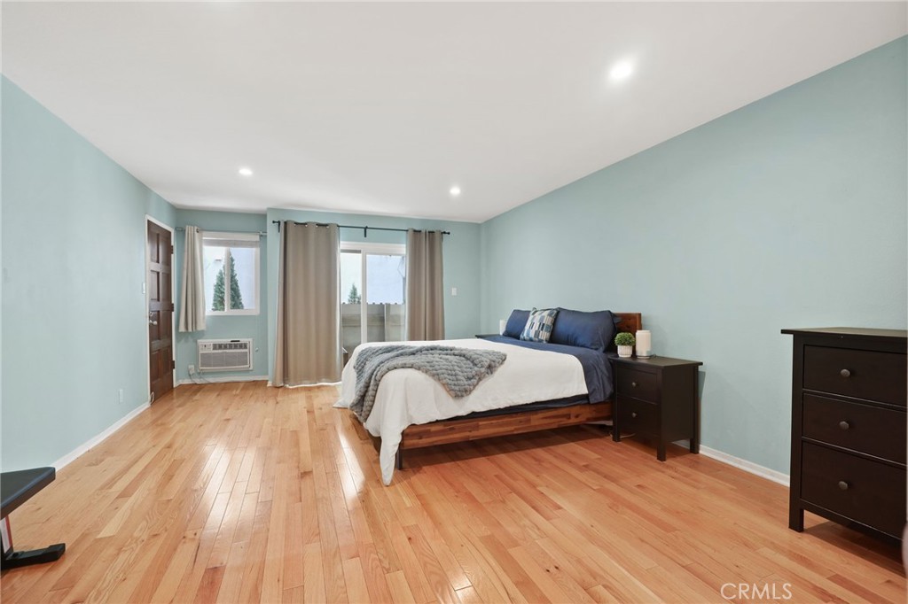 11954 Goshen Avenue, Unit 205 Los Angeles, CA 90049 - Photo 31 of 48 a spacious bedroom with a bed and a dresser