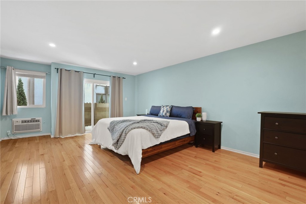 11954 Goshen Avenue, Unit 205 Los Angeles, CA 90049 - Photo 32 of 48 a spacious bedroom with a bed and a dresser