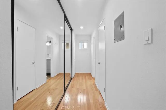 a bed room with a bed and a night stand