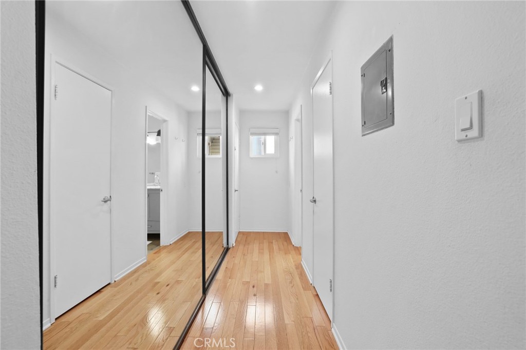 11954 Goshen Avenue, Unit 205 Los Angeles, CA 90049 - Photo 36 of 48 a view of hallway with wooden floor