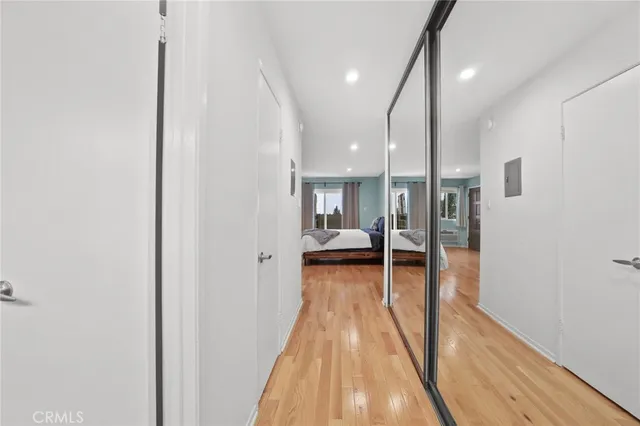 a view of hallway with wooden floor