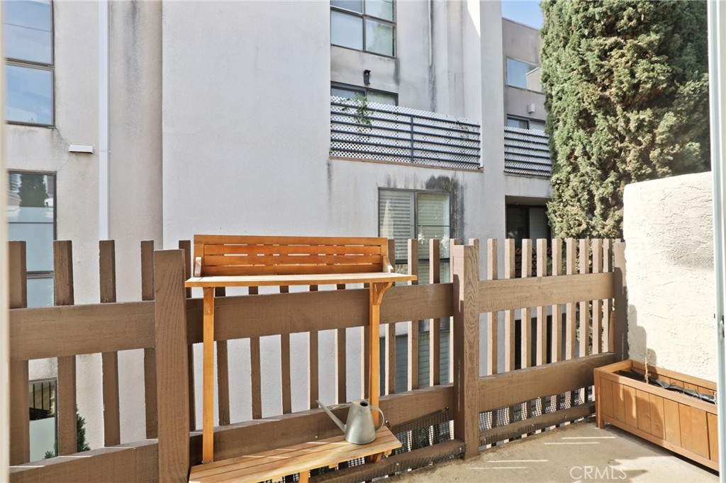 11954 Goshen Avenue, Unit 205 Los Angeles, CA 90049 - Photo 41 of 48 a view of a brick wall with a porch
