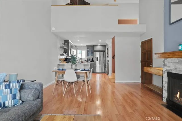 a dining room with furniture and wooden floor
