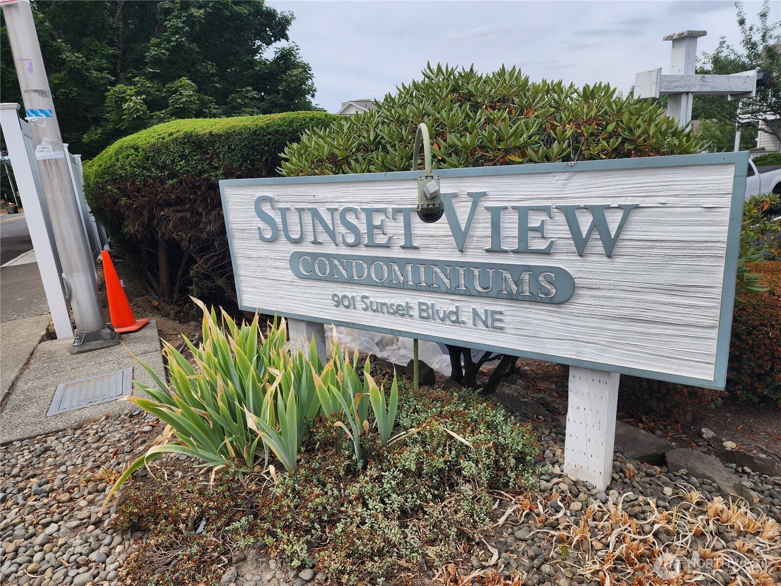 a view of a street sign under an umbrella