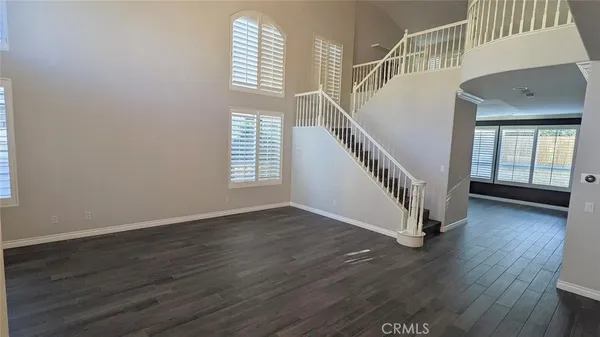 a view of an entryway with wooden floor