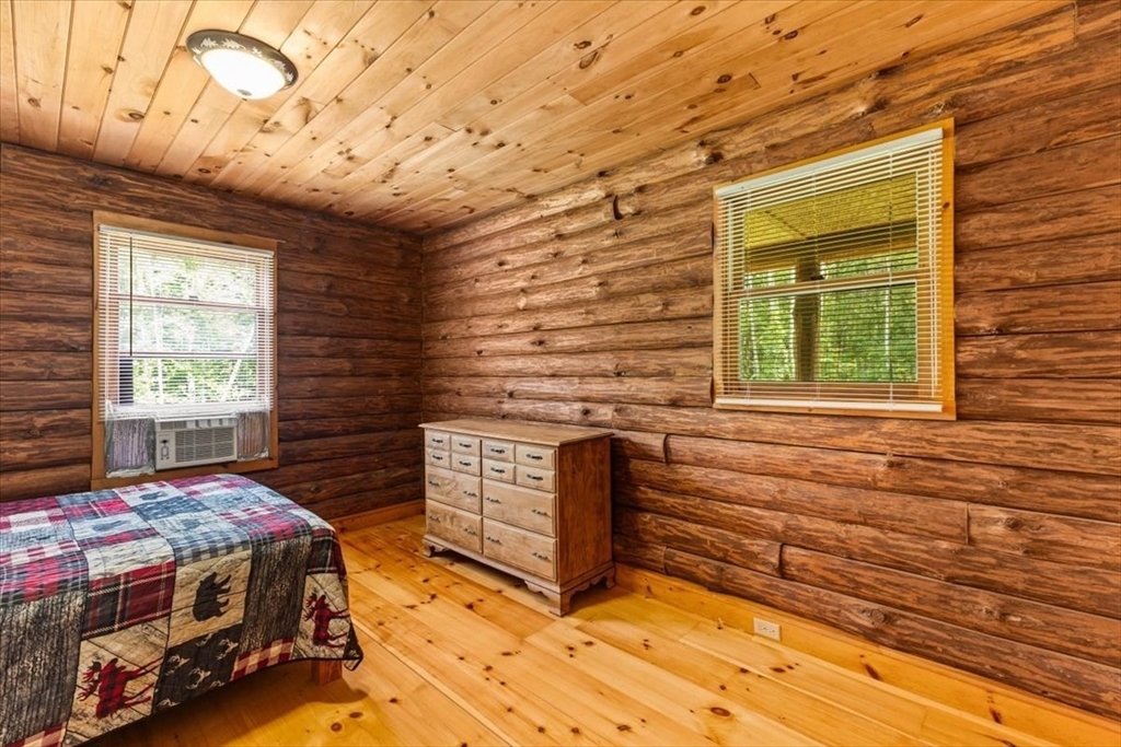 148 Braley Hill Road Rochester, MA 02770 - Photo 23 of 41 a bedroom with a bed and a window