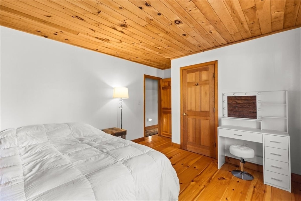148 Braley Hill Road Rochester, MA 02770 - Photo 25 of 41 a bedroom with a bed and a view of bedroom