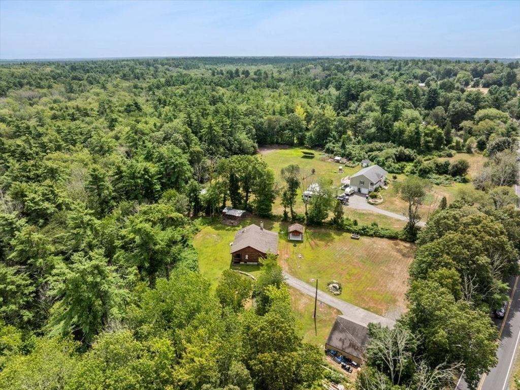 148 Braley Hill Road Rochester, MA 02770 - Photo 40 of 41 an aerial view of residential house with outdoor space and trees all around