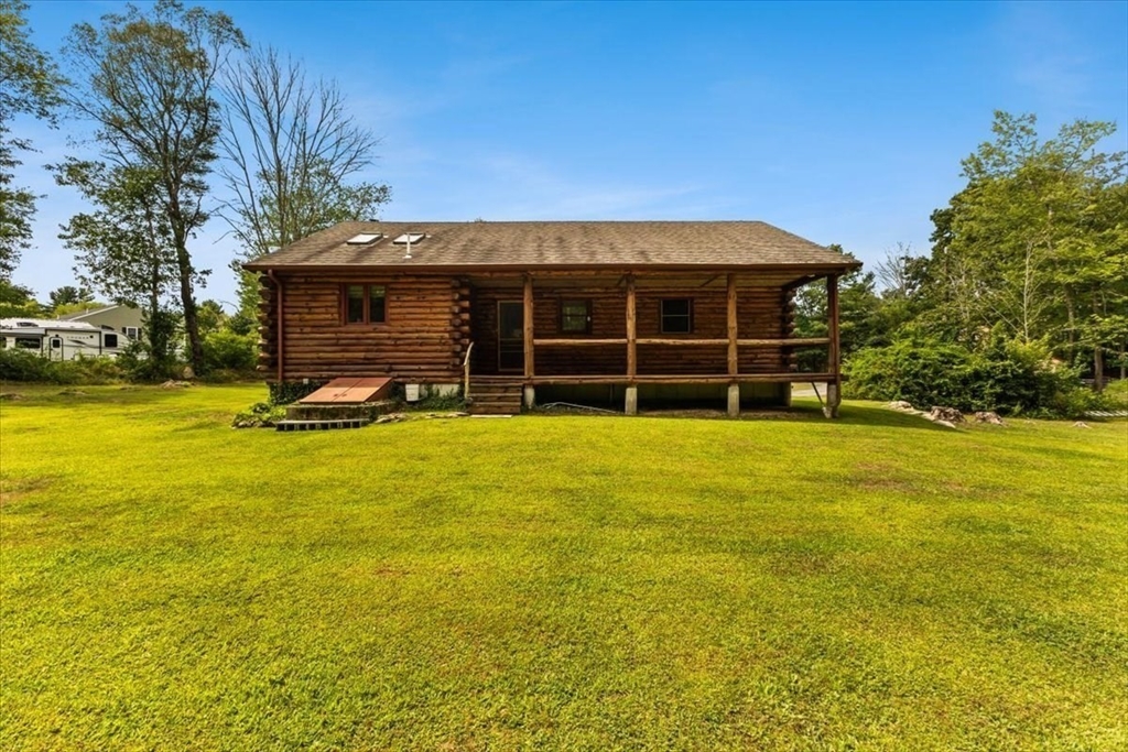 148 Braley Hill Road Rochester, MA 02770 - Photo 5 of 41 a view of a house with a yard and sitting area