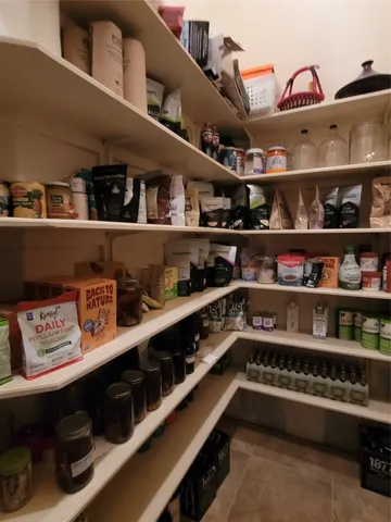 a kitchen with lots of bottles of alcohol