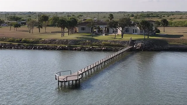 a view of a lake with a yard