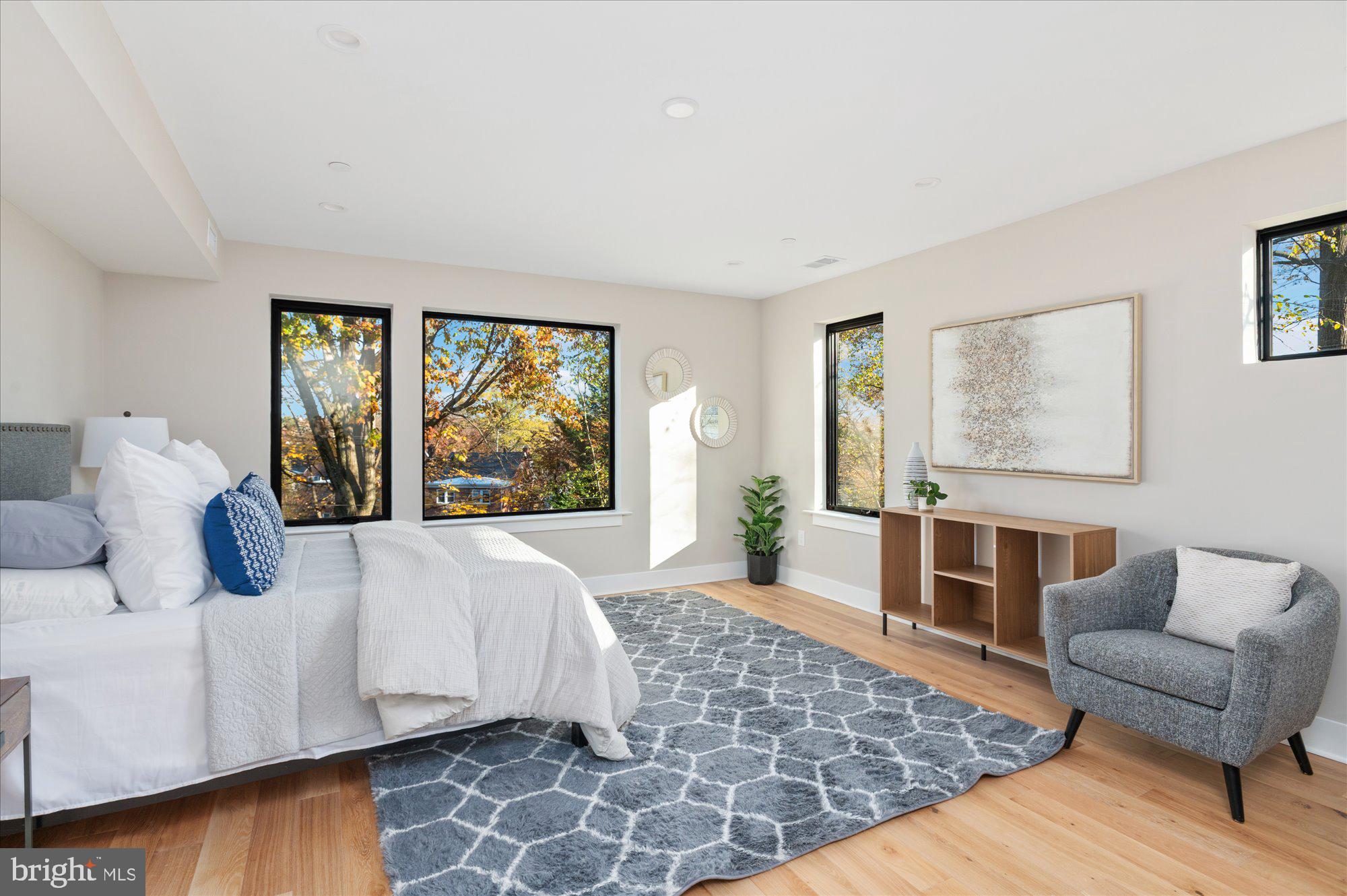 5445 33rd Street Northwest Washington, DC 20015 - Photo 30 of 72 a bedroom with a large bed and a couch