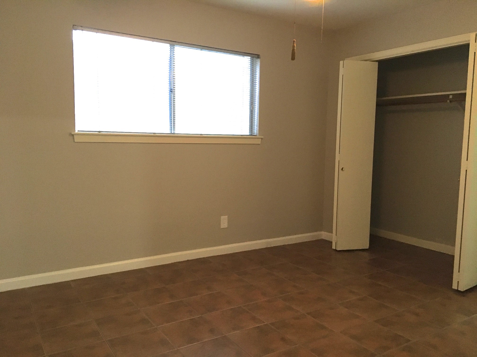 9307 Val Verde Street Houston, TX 77063 - Photo 12 of 17 an empty room with a window