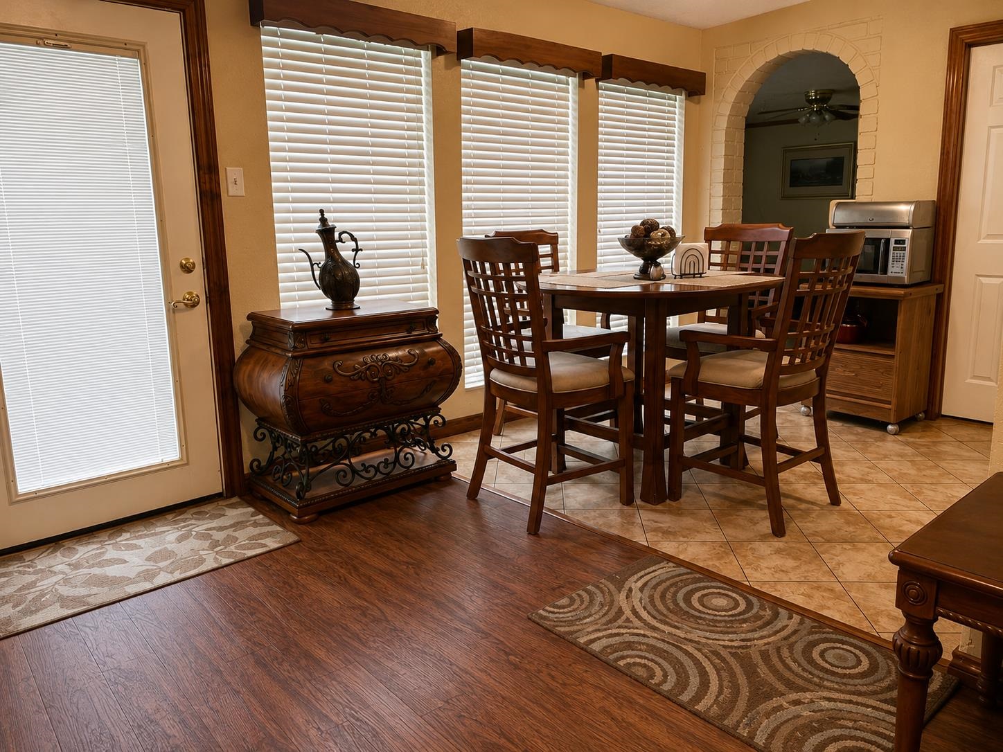 5845 Meadowview Road Beaumont, TX 77708 - Photo 10 of 24 a view of a dining room with furniture and wooden floor