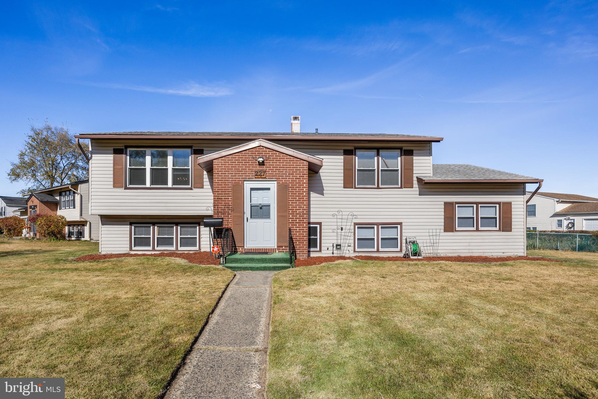 227 University Avenue Pemberton, NJ 08068 - Photo 1 of 33 a front view of a house with a yard
