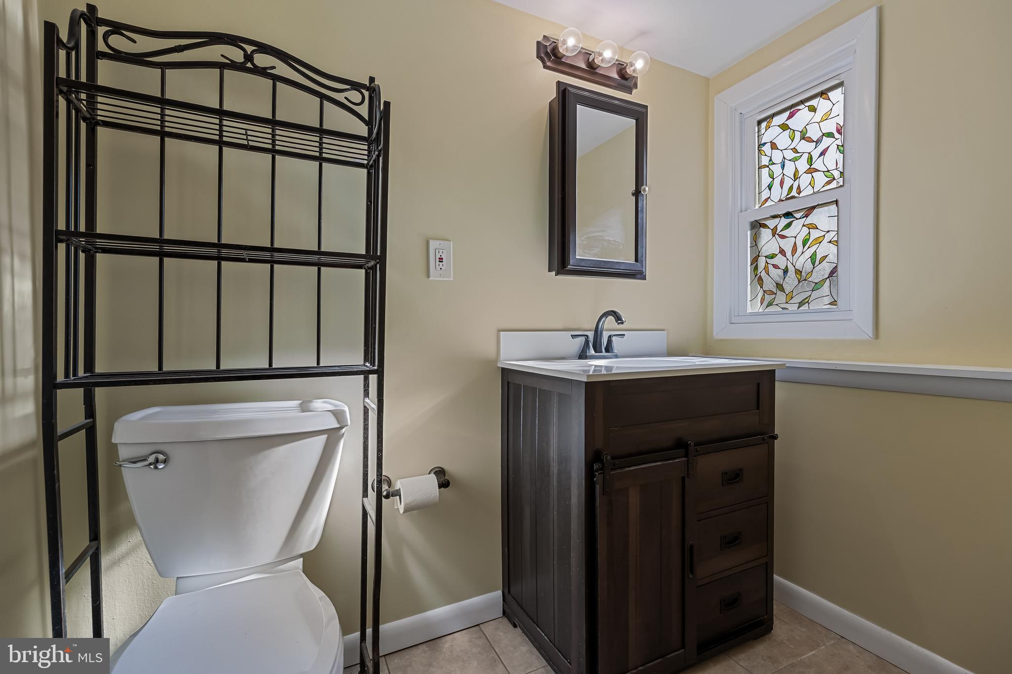 227 University Avenue Pemberton, NJ 08068 - Photo 22 of 33 a bathroom with a toilet sink and mirror