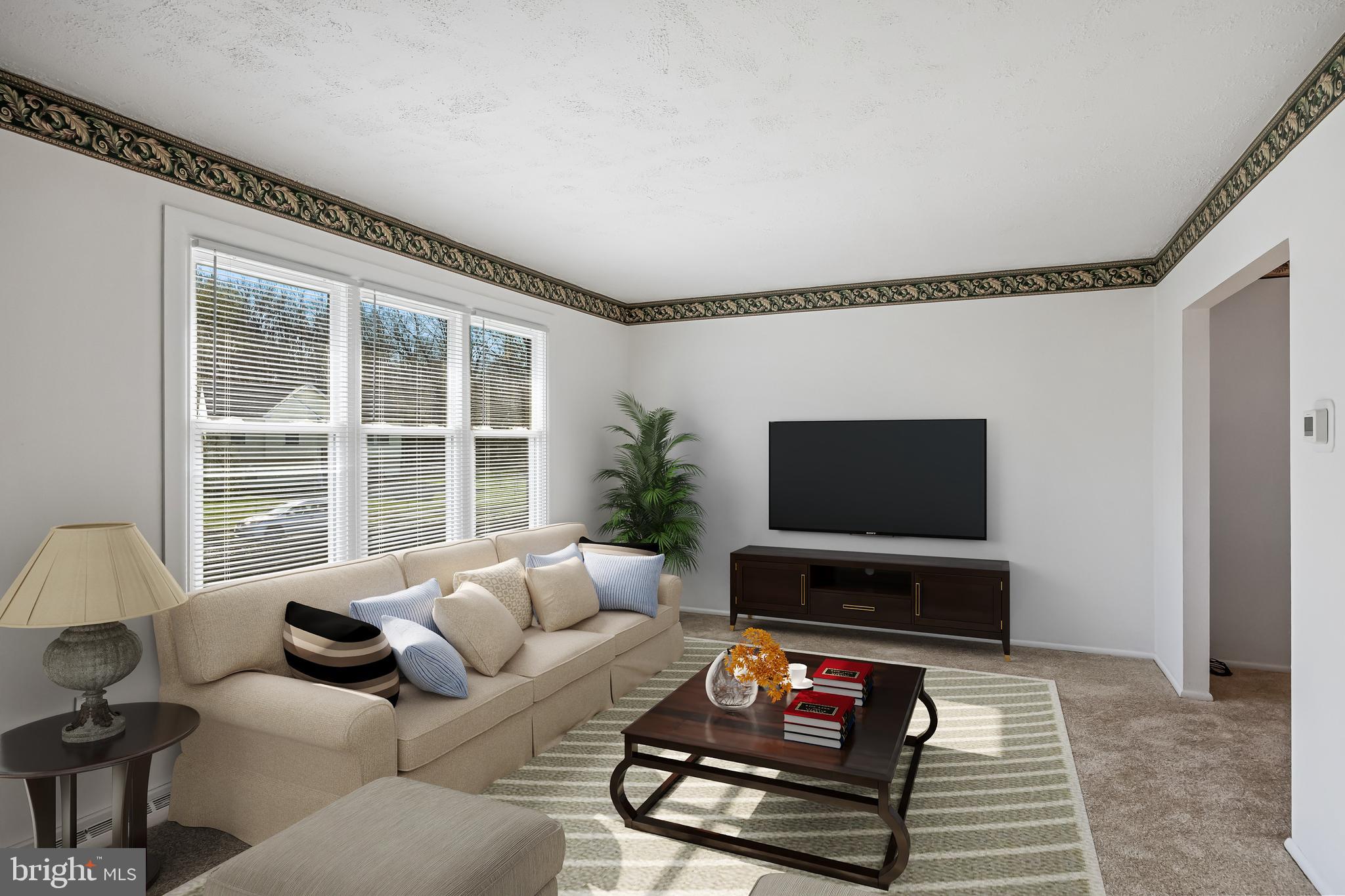 227 University Avenue Pemberton, NJ 08068 - Photo 4 of 33 a living room with furniture a flat screen tv and a window