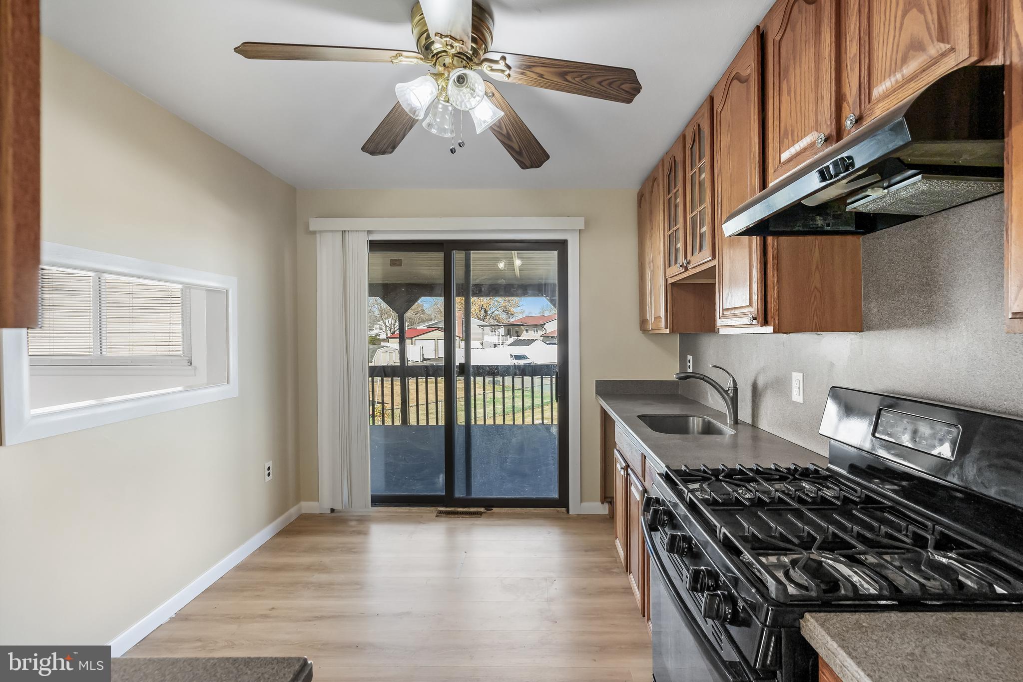 227 University Avenue Pemberton, NJ 08068 - Photo 8 of 33 a kitchen with stainless steel appliances granite countertop a stove and a refrigerator