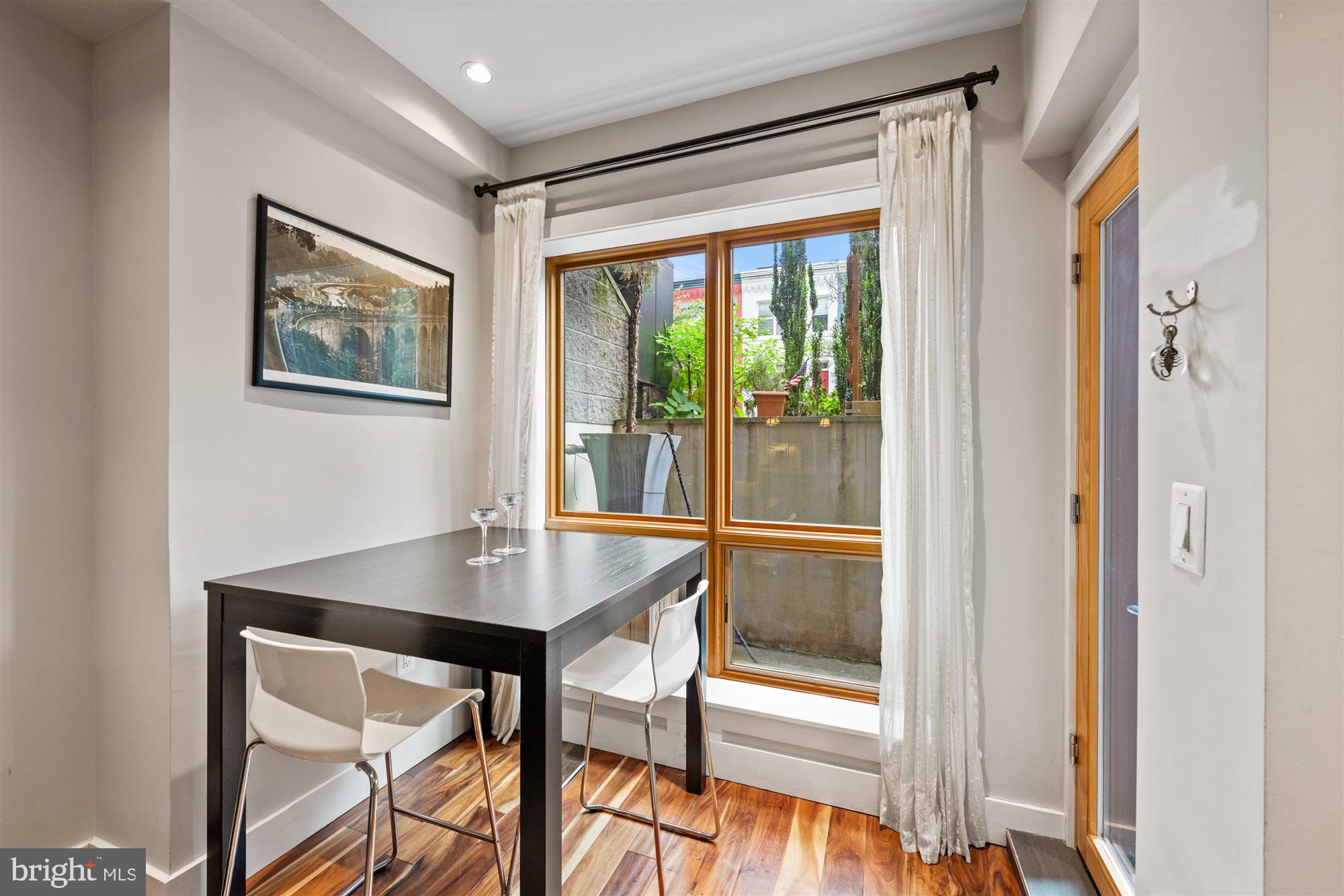 1337 K Street Southeast, Unit 101 Washington, DC 20003 - Photo 6 of 12 a workspace with furniture and window