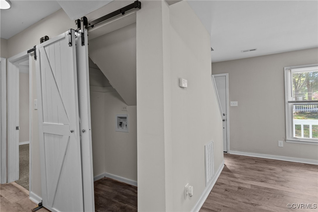 5237 Hallmark Drive Richmond, VA 23234 - Photo 11 of 44 a view of hallway with window and wooden floor