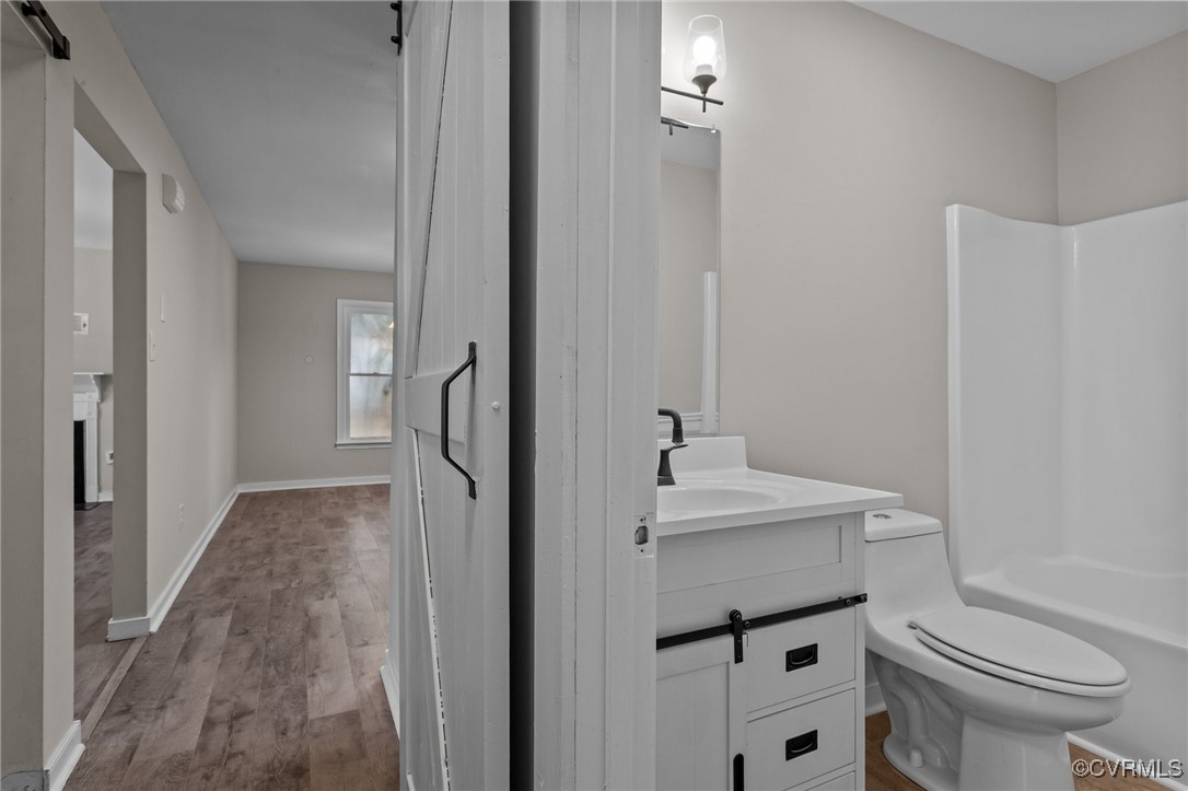 5237 Hallmark Drive Richmond, VA 23234 - Photo 13 of 44 a bathroom with a sink a toilet and a mirror