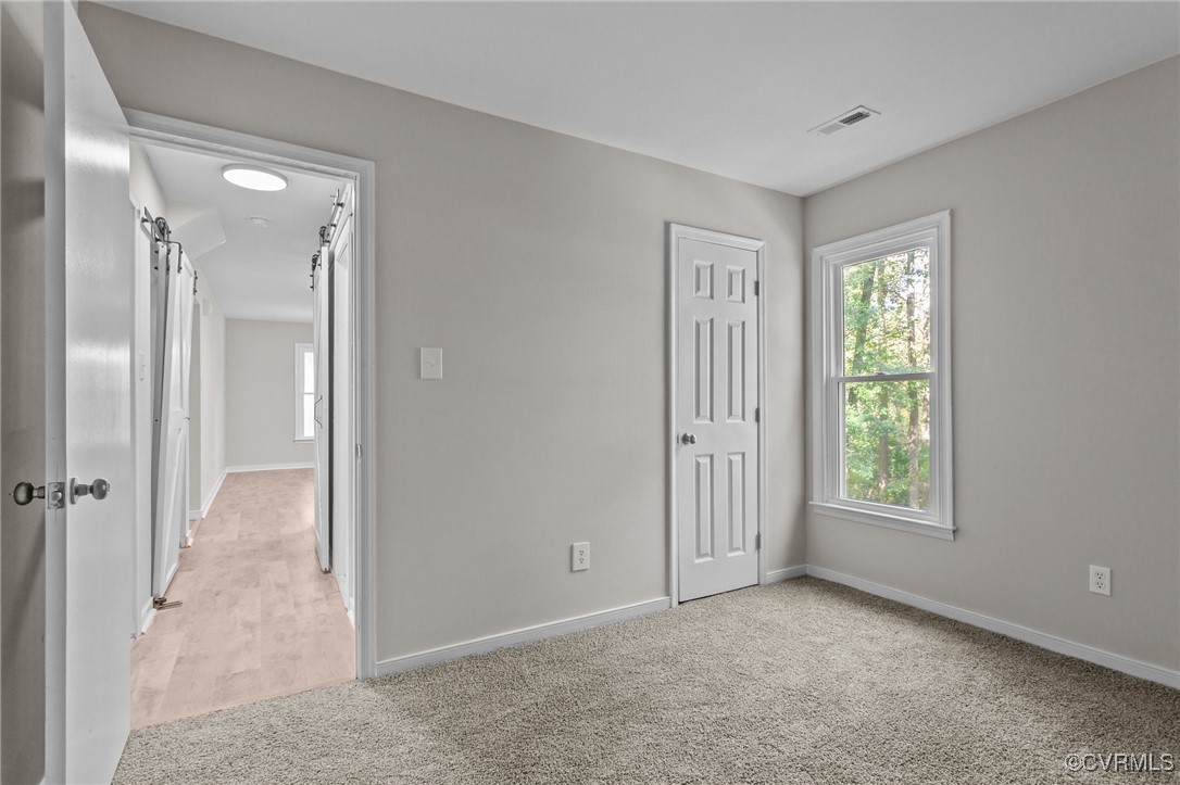 5237 Hallmark Drive Richmond, VA 23234 - Photo 14 of 44 a view of an empty room with window and closet area