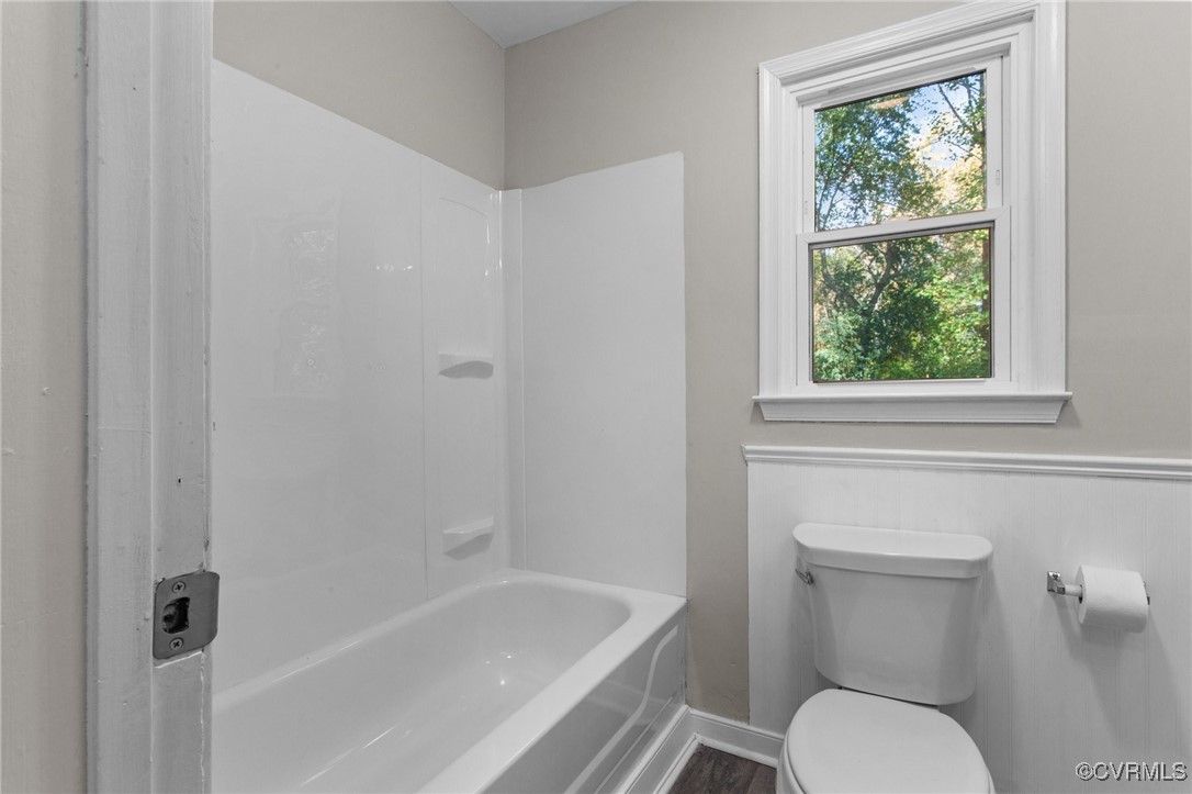 5237 Hallmark Drive Richmond, VA 23234 - Photo 19 of 44 a white toilet sitting next to a bath tub