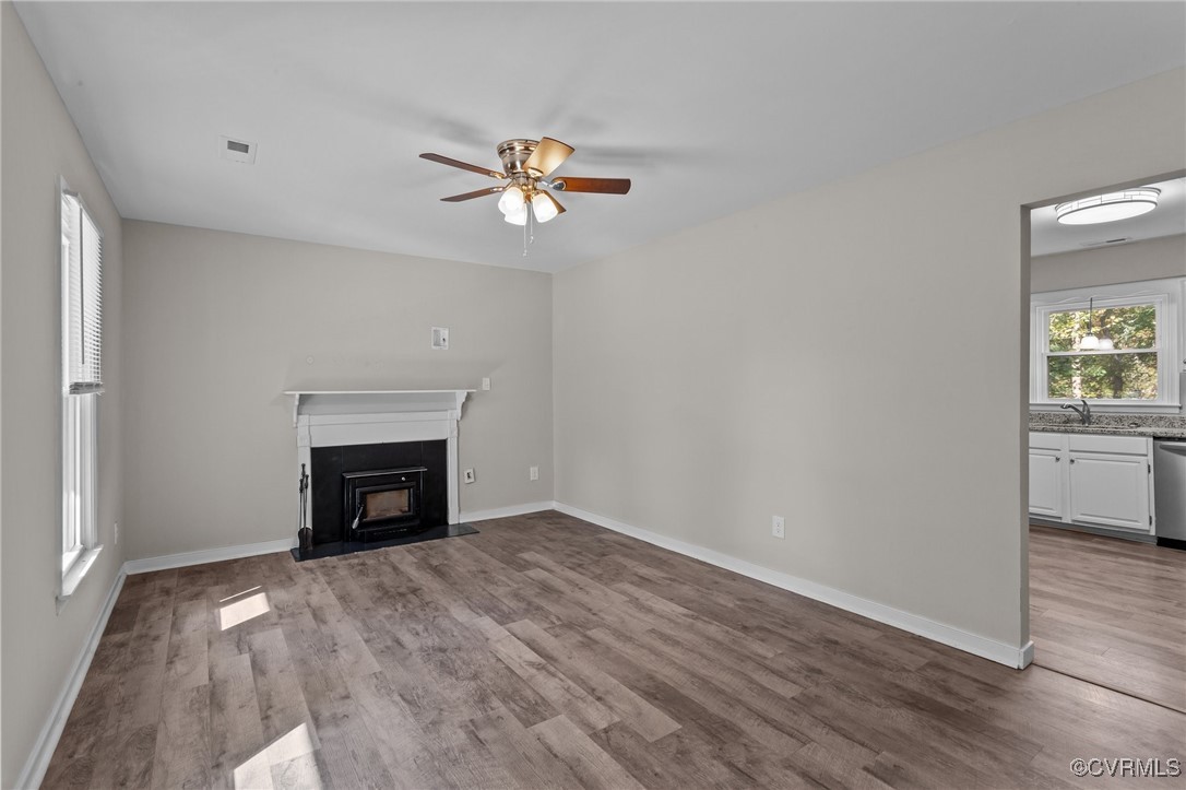 5237 Hallmark Drive Richmond, VA 23234 - Photo 3 of 44 a view of empty room with a fireplace and wooden floor