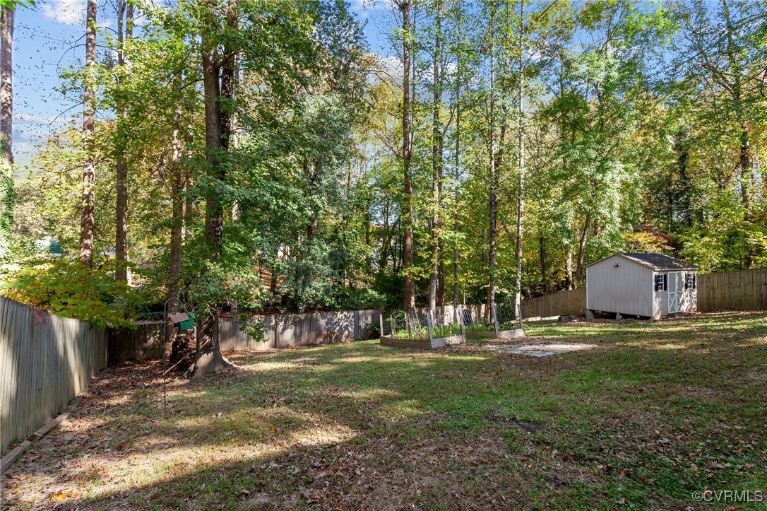 5237 Hallmark Drive Richmond, VA 23234 - Photo 38 of 44 a view of backyard with table and chairs and plants
