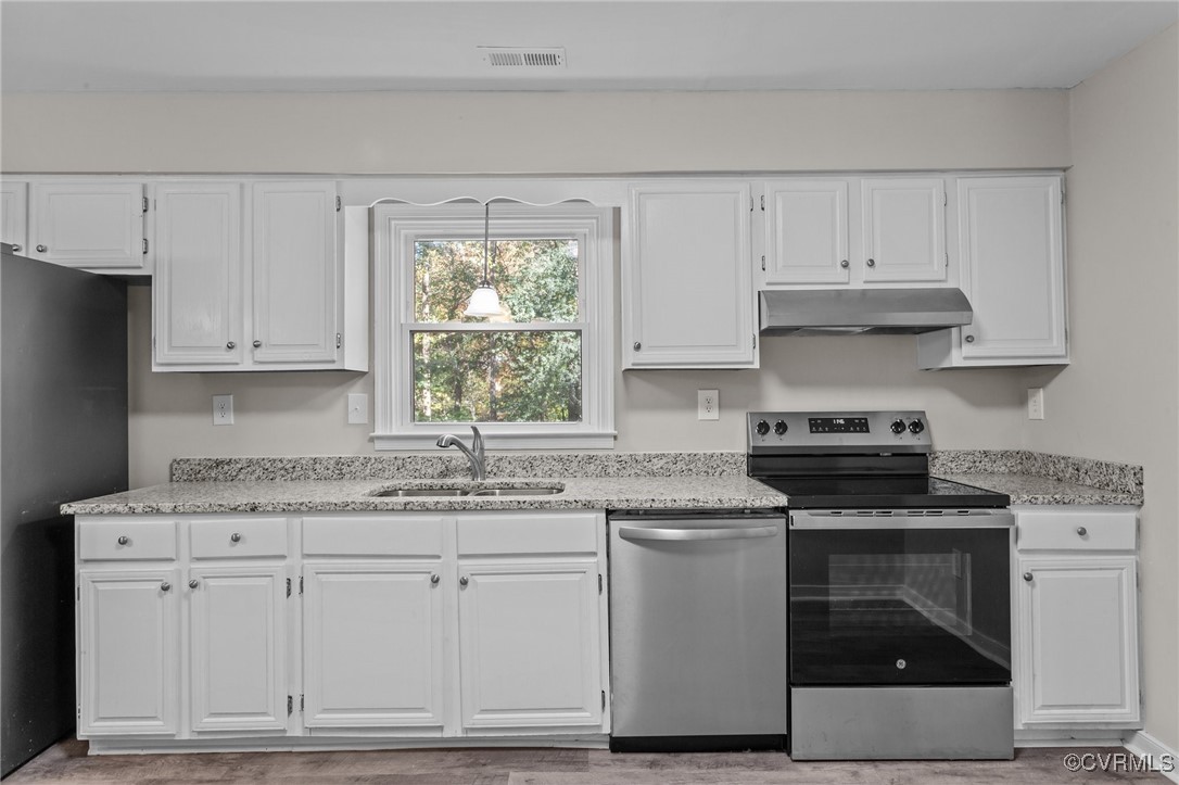 5237 Hallmark Drive Richmond, VA 23234 - Photo 8 of 44 a kitchen with granite countertop white cabinets and white stainless steel appliances