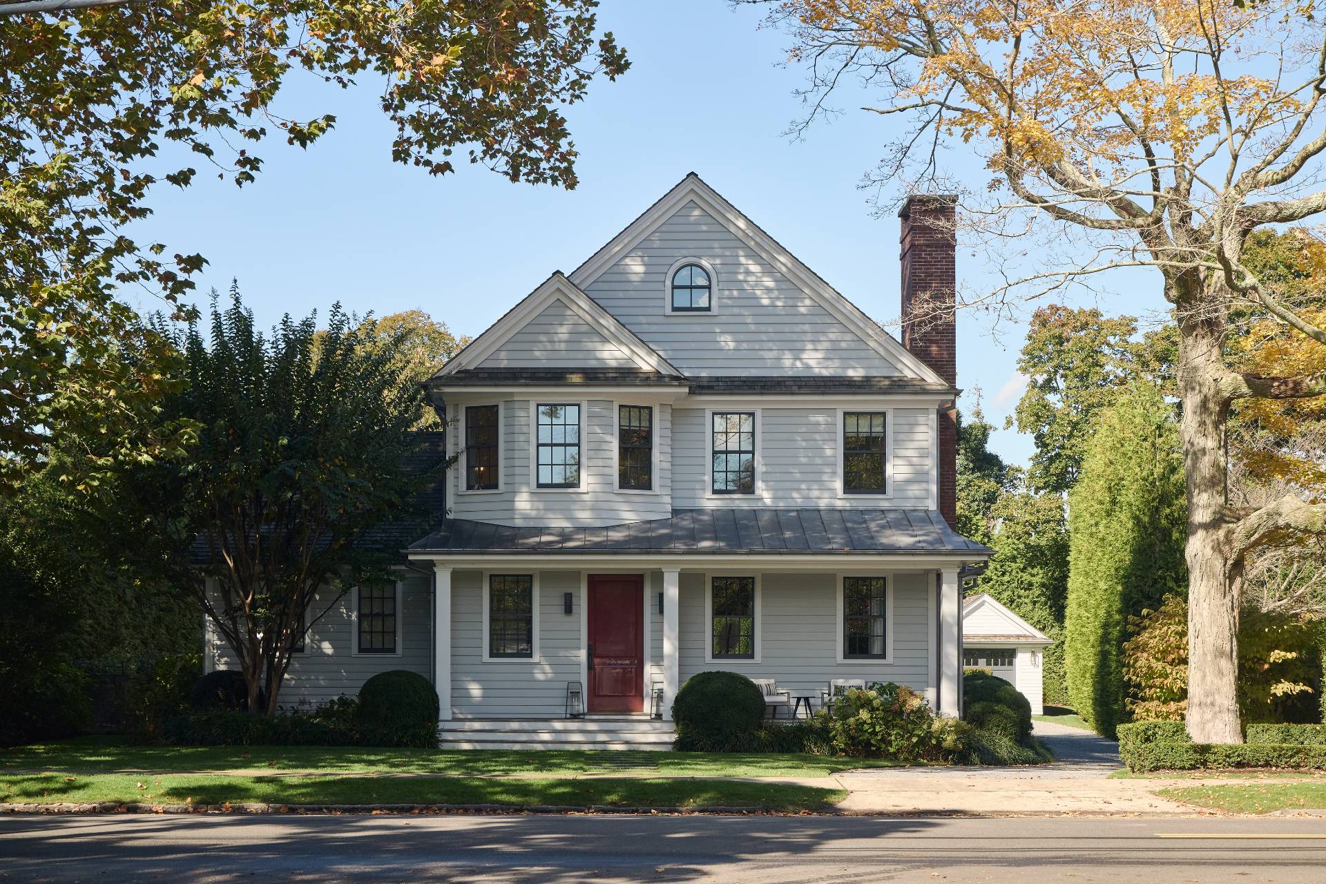 a front view of a house with a garden