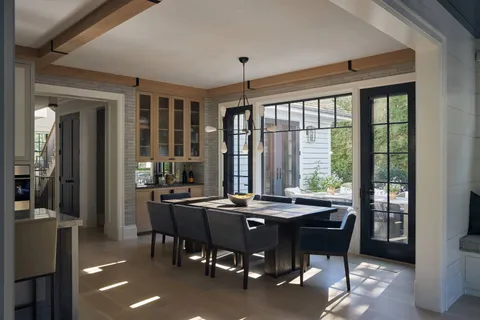 a view of a dining room with furniture and window