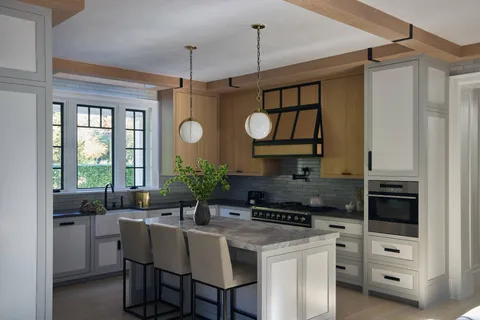 a kitchen with granite countertop a sink a counter space and windows