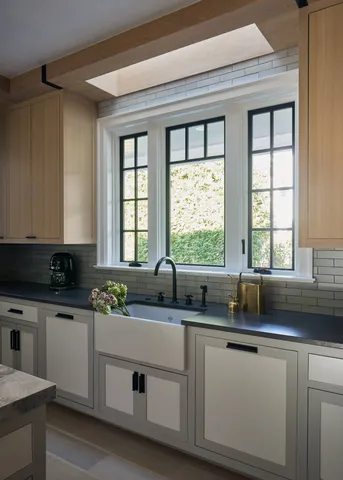 a kitchen with wooden cabinets and a stove top oven