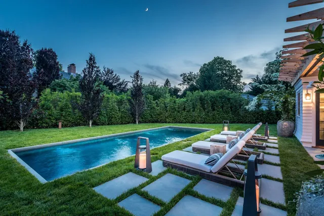 a view of a backyard with sitting area