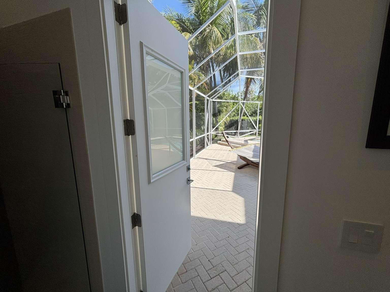11119 Blue Coral Drive Boca Raton, FL 33498 - Photo 11 of 36 a bathroom with a sink and glass door shower