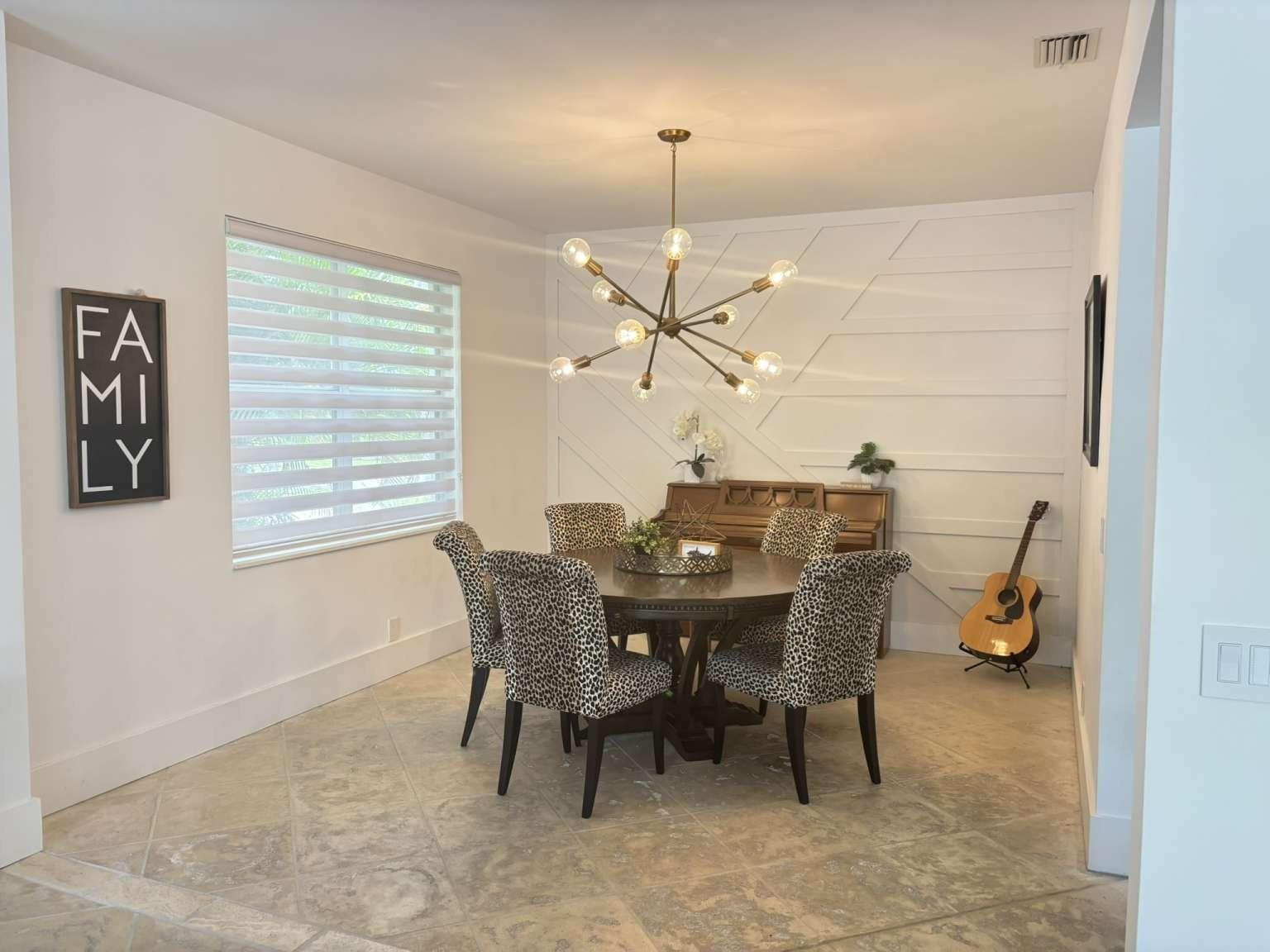11119 Blue Coral Drive Boca Raton, FL 33498 - Photo 15 of 36 a dining room with furniture and window