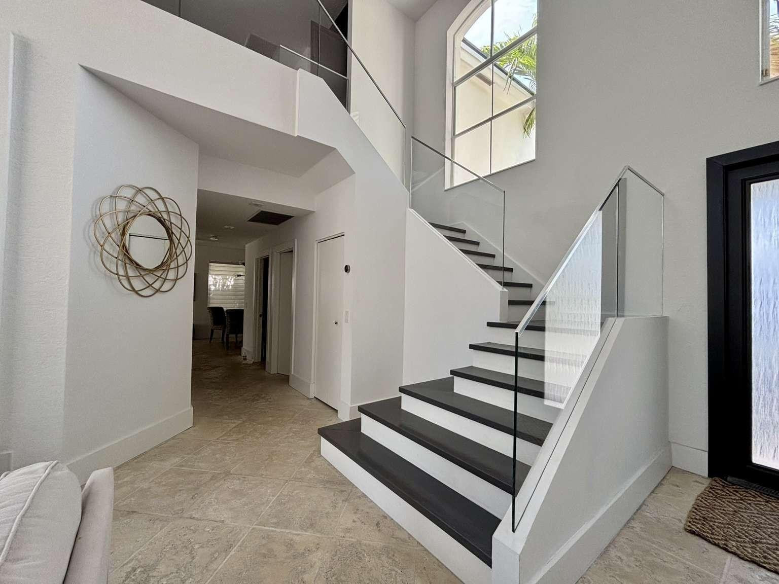 11119 Blue Coral Drive Boca Raton, FL 33498 - Photo 21 of 36 a view of entryway and hall with wooden floor