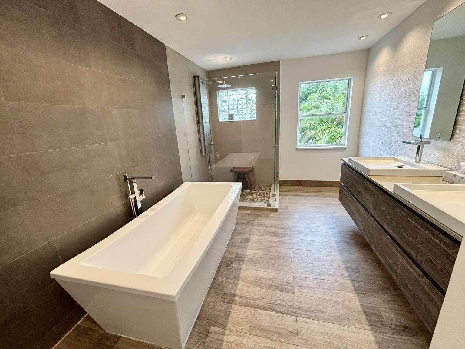 11119 Blue Coral Drive Boca Raton, FL 33498 - Photo 24 of 36 a bathroom with a sink and mirror