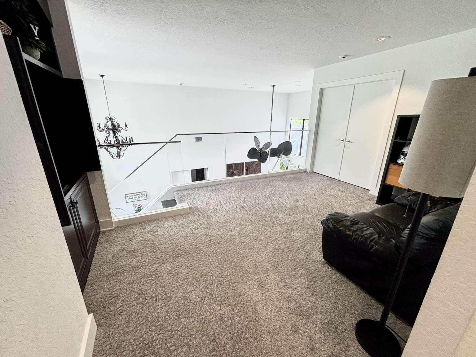 11119 Blue Coral Drive Boca Raton, FL 33498 - Photo 26 of 36 a living room with furniture and a flat screen tv
